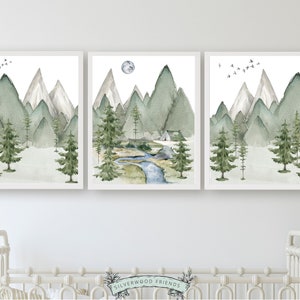 Transform your space into a serene mountain retreat with this enchanting set of 3 watercolor mountain and forest landscape prints, ideal for adding a touch of natural beauty to your mountain nursery or living room or bedroom décor.