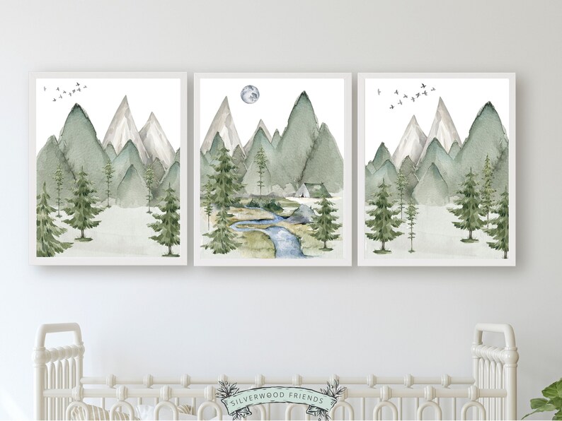 Transform your space into a serene mountain retreat with this enchanting set of 3 watercolor mountain and forest landscape prints, ideal for adding a touch of natural beauty to your mountain nursery or living room or bedroom décor.