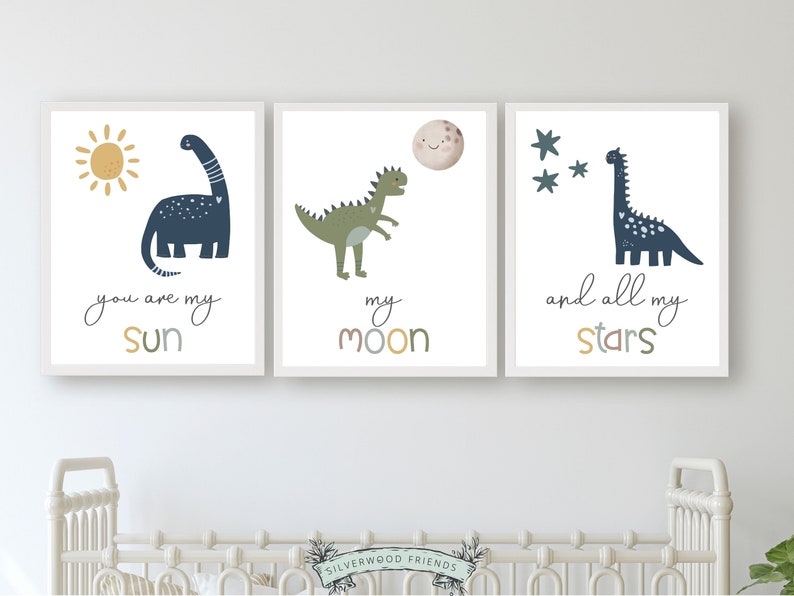 This Set of 3 Dinosaur Nursery Prints, featuring a sun, moon, stars and dinosaurs, along with the loving and positive quote "You are my sun, my moon, and all my stars" will create a harmonious and dreamy atmosphere in your nursery.