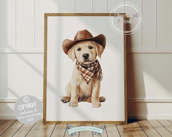 May include: A framed watercolor print of a golden retriever puppy wearing a brown cowboy hat and a plaid bandana. The artwork is set against a white background and framed in a wooden frame. The image includes text that reads "COPYRIGHT exclusive to Silverwood Friends 2025".