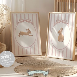 Our gorgeous baby girl Bunny Nursery Print Set, showcasing adorable bunny rabbits with pink stripes and bow, is perfect for your baby girls woodland nursery decor and makes a unique baby girl baby shower gift.