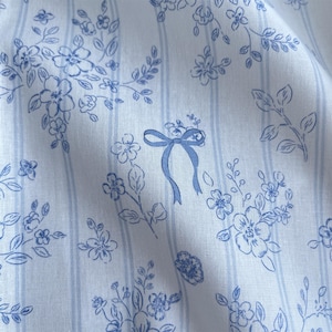 Tecido elegante com estampas florais azuis e laços, tecido listrado, vendido por metro para toalha de bebê, saia, tops, faixa de cabeça, fantasia