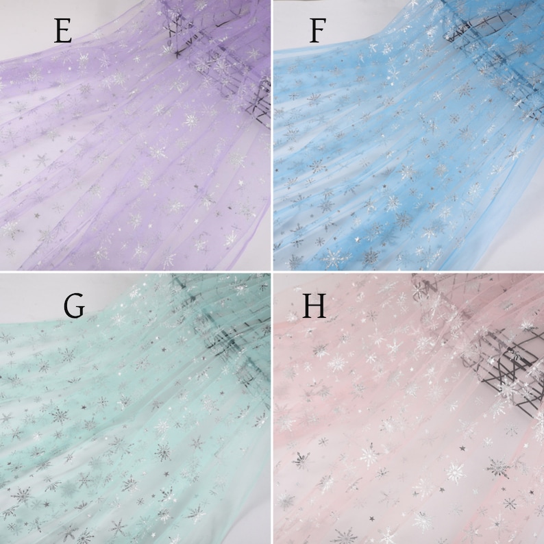 May include: Four swatches of sheer fabric with silver snowflake patterns. The swatches are in purple, light blue, light green, and pink.