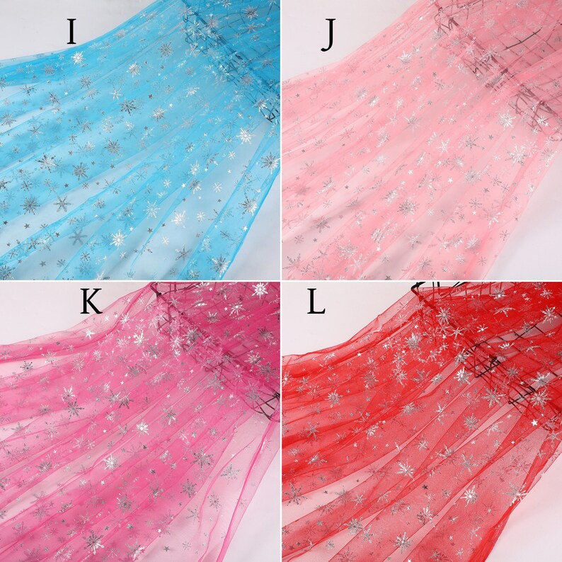 May include: Four swatches of sheer fabric with silver snowflake patterns. The swatches are in the colors light blue, pink, hot pink, and red.