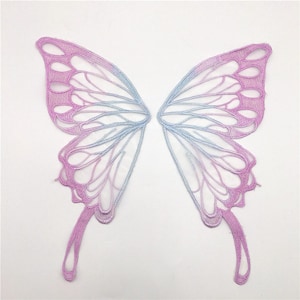 May include: A pair of delicate butterfly wings made of lace with a gradient of pink and blue colors.