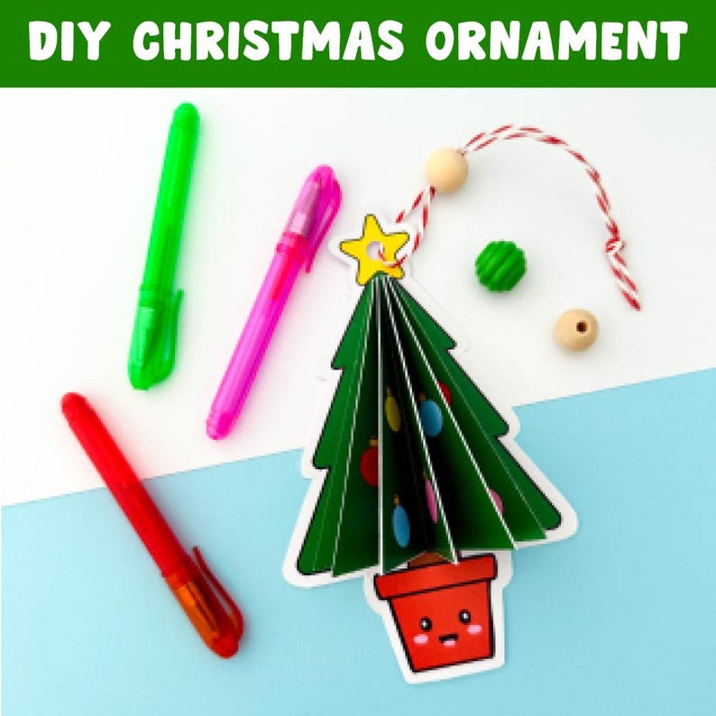 May include: A DIY Christmas ornament project featuring a green paper Christmas tree, red pot, and colourful pens. The text "DIY CHRISTMAS ORNAMENT" is at the top. The tree has a yellow star and is decorated with colourful ornaments. Other craft supplies include beads and a red and white string.