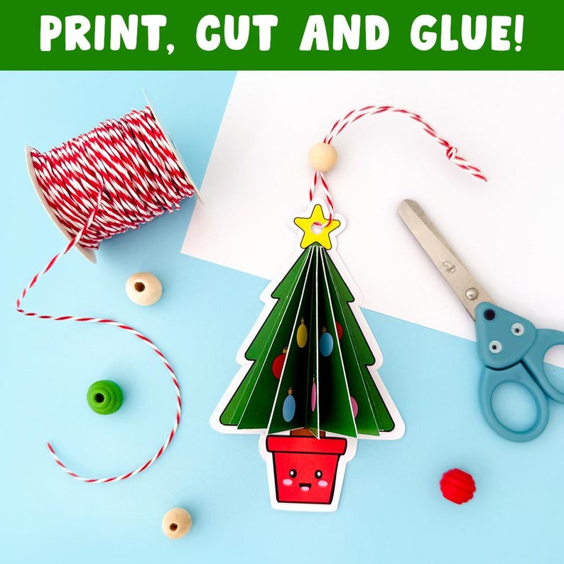 May include: A Christmas tree craft with the text "PRINT, CUT AND GLUE!" is shown. The tree is green with colourful baubles and a yellow star. A spool of red and white twine, wooden beads, scissors, and a red pom-pom are also present.