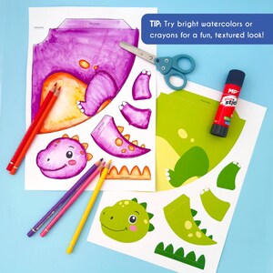 May include: A craft project featuring dinosaur cutouts, colored pencils, scissors, and glue stick. The dinosaur parts are printed on white paper and colored with purple, orange, and green hues. Text on the image reads: "TIP: Try bright watercolors or crayons for a fun, textured look!"
