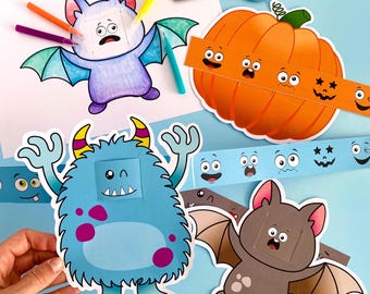 May include: A set of Halloween-themed paper crafts featuring a blue monster, a brown bat, and an orange pumpkin. Each character has a blank space for adding different expressions. A strip of paper with various facial expressions can be used to create different looks for each character.