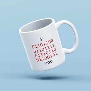 May include: White ceramic mug with the text "I 01101100 01101111 01110110 011100101 01100101 YOU" in red and black.