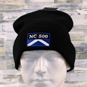 May include: Black beanie with a blue and white embroidered patch that says "NC 500".