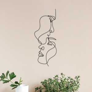 Arte de pared de metal de dos caras: decoración de pareja de una sola línea