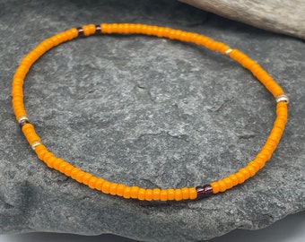 Fine bracelet made of orange-colored Miyuki beads