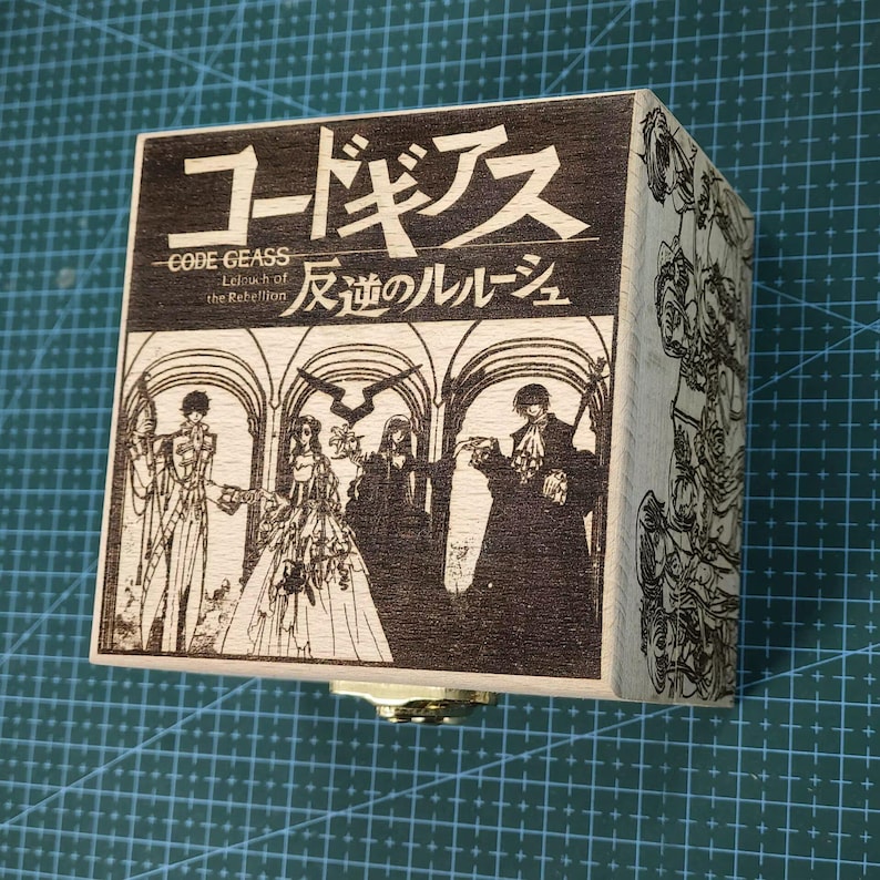 May include: A wooden music box with a laser-engraved image of characters from the anime Code Geass: Lelouch of the Rebellion. The box features the Japanese title "コードギアス 反逆のルルーシュ" and the English title "CODE GEASS Lelouch of the Rebellion".