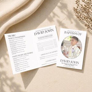 May include: A baptism program and invitation. The program is white with black text, including the name "David John" and the date "25 September 2026." The invitation features a photo of a young boy and the text "Welcome to the Baptism of David John."