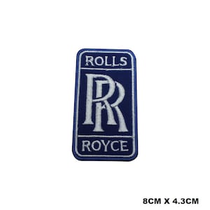 May include: Blue and white embroidered patch featuring the Rolls Royce logo. The logo displays the iconic double 'R' symbol and the words "Rolls" and "Royce" in white lettering.