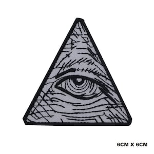 May include: A triangular patch featuring an eye within a triangle, with intricate black line details on a light gray background. The patch is outlined in black and measures 6cm x 6cm.