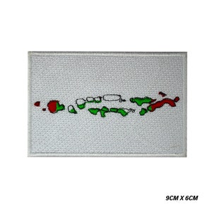 May include: White embroidered patch with a green and red outline of the Virgin Islands. The patch measures 9 inches by 6 inches.