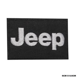May include: White embroidered "Jeep" logo patch on a black fabric background. The patch measures 6 cm by 8.6 cm.