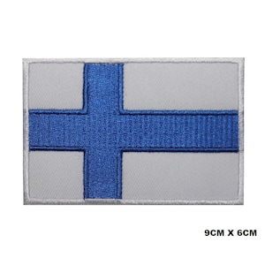 May include: Embroidered patch of the Finnish flag. The flag is white with a blue cross. The patch is 9 inches by 6 inches.