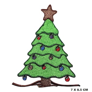 May include: Green felt Christmas tree applique with a brown star on top and colorful ornaments. The tree has a brown trunk and a brown base. The applique measures 7 inches by 8.5 inches.