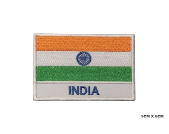 May include: An embroidered iron-on patch featuring the Indian flag with the words "INDIA" below. The flag is orange, white, and green with a blue wheel in the centre. The patch is 9 cm by 6 cm.