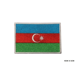 May include: Embroidered patch of the Azerbaijani flag. The flag is blue, red, and green with a white crescent moon and star in the center. The patch is 9 cm by 6 cm.