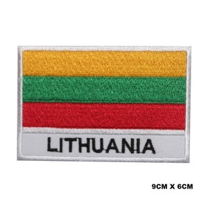 May include: Embroidered patch of the Lithuanian flag with yellow, green, and red stripes. The patch is white with a gray border and the word "LITHUANIA" in black text. The patch is 9 inches by 6 inches.