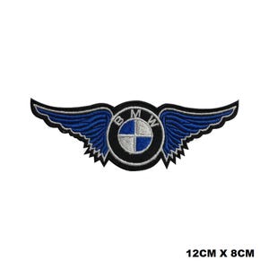 May include: Blue and silver embroidered patch with the BMW logo and wings. The patch is 12 inches by 8 inches.