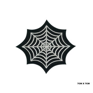 May include: Black spiderweb patch with white stitching. The patch is 7 cm by 7 cm.