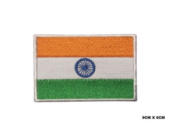 May include: An embroidered iron-on patch of the Indian flag. The flag is a tri-colour of saffron, white, and green with a blue wheel in the centre of the white band. The patch measures 9 cm by 6 cm.