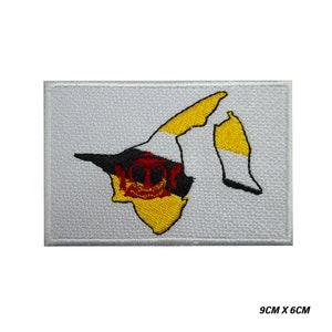 May include: An embroidered patch featuring the outline of Brunei, with the country's flag colors and crest in the center. The patch is white with a gray background and measures 9 inches by 6 inches.