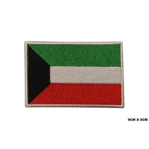 May include: An embroidered patch of the flag of Kuwait. The flag is green, white, and red with a black triangle in the top left corner. The patch is 9 cm by 6 cm.