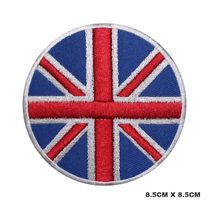 Puede incluir: Un parche redondo bordado con la bandera del Reino Unido en rojo, blanco y azul. El parche tiene un diámetro de 8,5 cm.