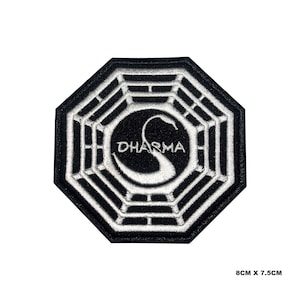 May include: Embroidered black and white patch featuring the Dharma logo. The octagonal patch has a geometric design in white and black. The text "DHARMA" is in white, within a black circle. The patch measures 8cm x 7.5cm.