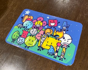 May include: A rectangular sticker featuring a cartoon illustration of various animated objects with faces, set against a blue starry sky and green grass. The characters include a flower, a tennis ball, a sponge, and a pencil.