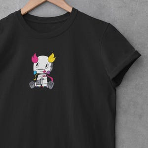 May include: Black t-shirt with a small, colorful cartoon robot embroidered on the front.