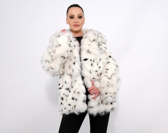 Fox fur jacket with a stamp cat lynx.Saga furs auction Scandinavian fox fur at white color.Features of this model: straight  silhouette