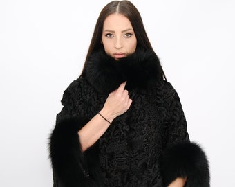 Astrakhan and fox fur jacket,An elegant bat-style jacket made of astrakhan and fox fur from Saga Furs in black color, cozy and elegant