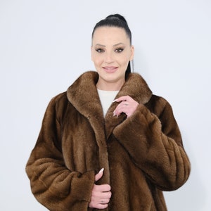 Mink fur jacket. Saga furs auction Scandinavian mink fur jacket in demi buff color.Features of this model: straight  silhouette