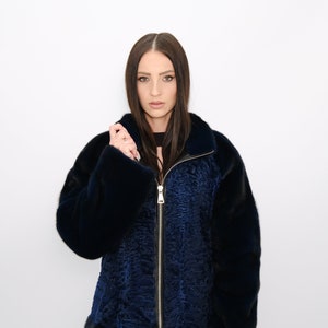 Mink and astrakhan fur jacket.Jacket made of auction Scandinavian mink and astrakhan fur by Saga Furs in blue-black. Sporty silhouette