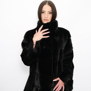 MINK FUR JACKET,A comfortable jacket made of Saga Furs mink in black color, a cozy and elegant fur jacket for your winter holidays.