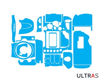May include: A blue camera skin kit for a Nikon camera. The kit includes a variety of pieces to cover the camera body, lens, and other parts.