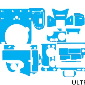 May include: A set of blue vinyl decals for a camera. The decals are designed to cover the camera body and various buttons. The decals are sold by the company ULTRA Skins.