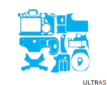 May include: A blue camera skin kit for a DSLR camera. The kit includes a variety of pieces to cover the camera body, lens, and other parts. The kit is designed to protect the camera from scratches and wear and tear.