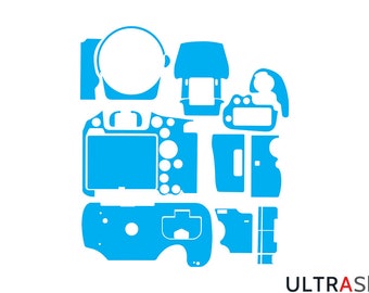 May include: A blue and white graphic of camera parts, likely a skin or template. The design includes various shapes representing different camera components, such as the body, lens, and buttons. The text "ULTRAskins" is in the bottom right corner.
