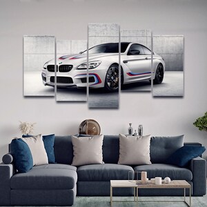May include: A white BMW M6 sports car with blue and red racing stripes, displayed in a five-piece canvas print set.