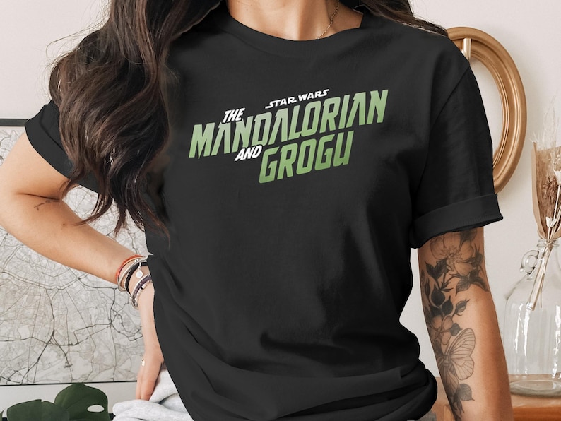 Black t-shirt with The Mandalorian and Grogu logo.