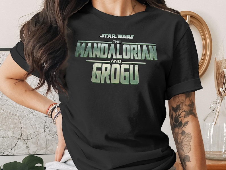 Black t-shirt with Star Wars: The Mandalorian and Grogu logo.