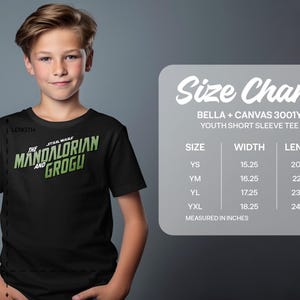 Boy in Star Wars Mandalorian Grogu t-shirt next to size chart.